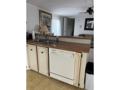 Nicely maintained furnished home on nice lot with no rear on Lake Henry Golf Club in Florida - for sale on GolfHomes.com, golf home, golf lot