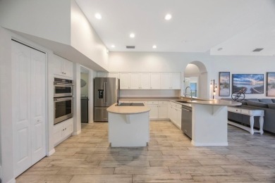 Welcome to this beautifully updated 4-bedroom, 3-bath home in on River Wilderness Golf and Country Club in Florida - for sale on GolfHomes.com, golf home, golf lot