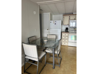 Nicely maintained furnished home on nice lot with no rear on Lake Henry Golf Club in Florida - for sale on GolfHomes.com, golf home, golf lot