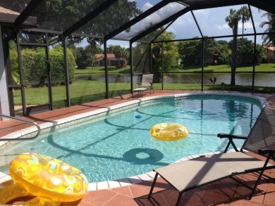 Adorable 3/2 pool home with lake views. Lowest price for a on Boca Greens Country Club in Florida - for sale on GolfHomes.com, golf home, golf lot