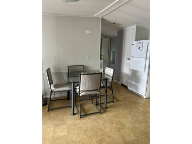 Nicely maintained furnished home on nice lot with no rear on Lake Henry Golf Club in Florida - for sale on GolfHomes.com, golf home, golf lot