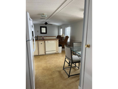 Nicely maintained furnished home on nice lot with no rear on Lake Henry Golf Club in Florida - for sale on GolfHomes.com, golf home, golf lot