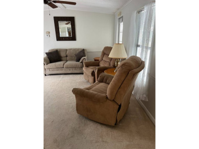 Nicely maintained furnished home on nice lot with no rear on Lake Henry Golf Club in Florida - for sale on GolfHomes.com, golf home, golf lot