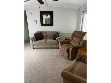 Nicely maintained furnished home on nice lot with no rear on Lake Henry Golf Club in Florida - for sale on GolfHomes.com, golf home, golf lot