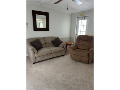 Nicely maintained furnished home on nice lot with no rear on Lake Henry Golf Club in Florida - for sale on GolfHomes.com, golf home, golf lot