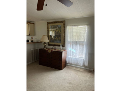Nicely maintained furnished home on nice lot with no rear on Lake Henry Golf Club in Florida - for sale on GolfHomes.com, golf home, golf lot