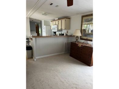 Nicely maintained furnished home on nice lot with no rear on Lake Henry Golf Club in Florida - for sale on GolfHomes.com, golf home, golf lot