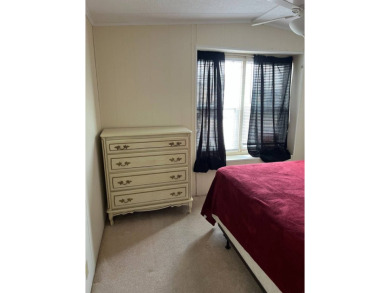 Nicely maintained furnished home on nice lot with no rear on Lake Henry Golf Club in Florida - for sale on GolfHomes.com, golf home, golf lot