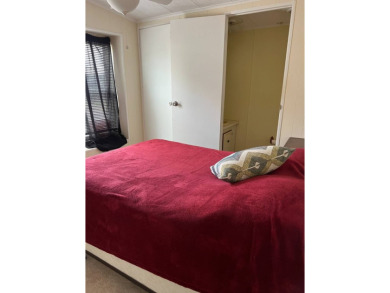 Nicely maintained furnished home on nice lot with no rear on Lake Henry Golf Club in Florida - for sale on GolfHomes.com, golf home, golf lot