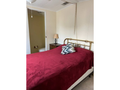 Nicely maintained furnished home on nice lot with no rear on Lake Henry Golf Club in Florida - for sale on GolfHomes.com, golf home, golf lot