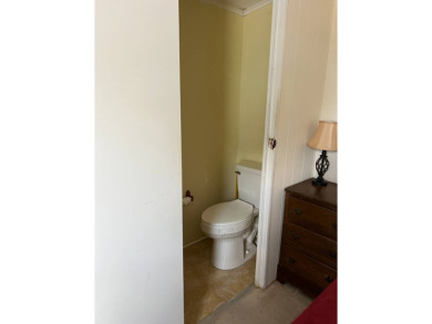 Nicely maintained furnished home on nice lot with no rear on Lake Henry Golf Club in Florida - for sale on GolfHomes.com, golf home, golf lot