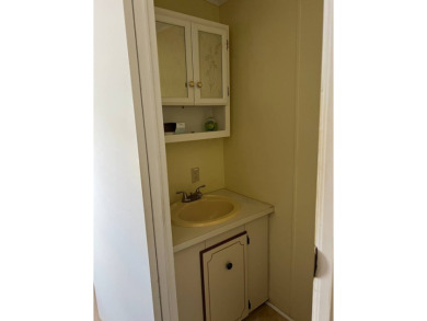 Nicely maintained furnished home on nice lot with no rear on Lake Henry Golf Club in Florida - for sale on GolfHomes.com, golf home, golf lot