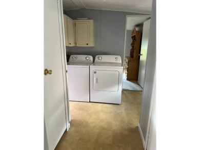Nicely maintained furnished home on nice lot with no rear on Lake Henry Golf Club in Florida - for sale on GolfHomes.com, golf home, golf lot