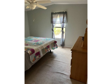 Nicely maintained furnished home on nice lot with no rear on Lake Henry Golf Club in Florida - for sale on GolfHomes.com, golf home, golf lot