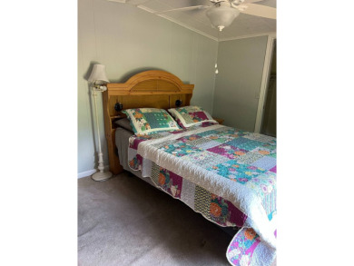 Nicely maintained furnished home on nice lot with no rear on Lake Henry Golf Club in Florida - for sale on GolfHomes.com, golf home, golf lot