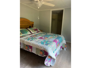 Nicely maintained furnished home on nice lot with no rear on Lake Henry Golf Club in Florida - for sale on GolfHomes.com, golf home, golf lot