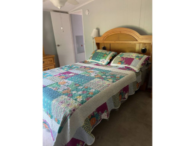 Nicely maintained furnished home on nice lot with no rear on Lake Henry Golf Club in Florida - for sale on GolfHomes.com, golf home, golf lot