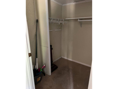 Nicely maintained furnished home on nice lot with no rear on Lake Henry Golf Club in Florida - for sale on GolfHomes.com, golf home, golf lot