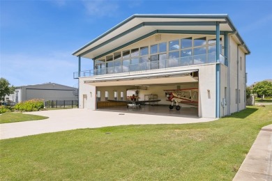Don't miss your rare opportunity to live with your airplanes on Pecan Plantation Country Club in Texas - for sale on GolfHomes.com, golf home, golf lot
