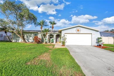 This spacious 4-bedroom, 2-bathroom pool home features a on Mangrove Bay Golf Course in Florida - for sale on GolfHomes.com, golf home, golf lot
