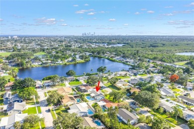 This spacious 4-bedroom, 2-bathroom pool home features a on Mangrove Bay Golf Course in Florida - for sale on GolfHomes.com, golf home, golf lot