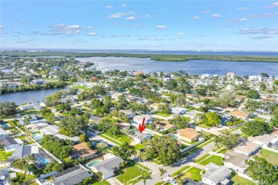 This spacious 4-bedroom, 2-bathroom pool home features a on Mangrove Bay Golf Course in Florida - for sale on GolfHomes.com, golf home, golf lot