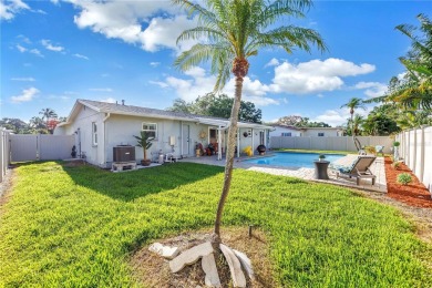 This spacious 4-bedroom, 2-bathroom pool home features a on Mangrove Bay Golf Course in Florida - for sale on GolfHomes.com, golf home, golf lot