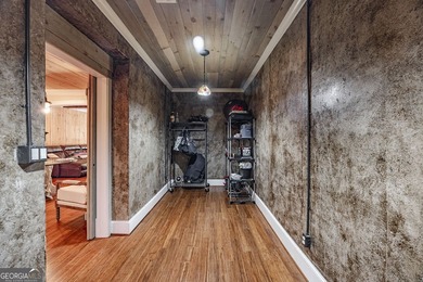 One of a kind custom home in River Forest. This home boasts curb on The Club River Forest in Georgia - for sale on GolfHomes.com, golf home, golf lot