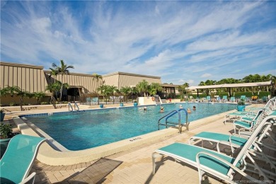 Enjoy your private entrance in this first floor, end unit condo on Martin County Golf Course in Florida - for sale on GolfHomes.com, golf home, golf lot