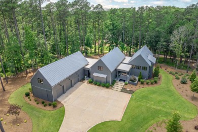 You'll find classic elegance in this transitional-style lake on Reynolds Lake Oconee - The Oconee in Georgia - for sale on GolfHomes.com, golf home, golf lot