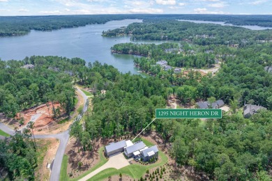 You'll find classic elegance in this transitional-style lake on Reynolds Lake Oconee - The Oconee in Georgia - for sale on GolfHomes.com, golf home, golf lot