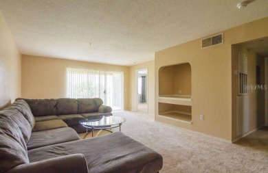 This lovely 2-bedroom, 2-bathroom condo overlooking the Hunters on Hunters Creek Golf Course in Florida - for sale on GolfHomes.com, golf home, golf lot