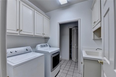 Nestled within the prestigious, guard-gated enclave of St Ives on St. Ives Golf and Country Club in Georgia - for sale on GolfHomes.com, golf home, golf lot