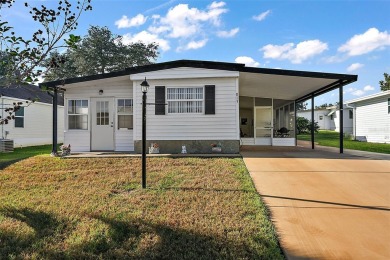 Welcome to this charming two-bedroom, one-bathroom home nestled on El Diablo Executive Golf Course in Florida - for sale on GolfHomes.com, golf home, golf lot