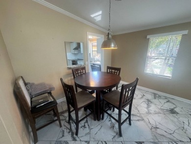 Lot Rent $1342.00 Monthly  Total square footage under A/C is on Del Tura Golf and Country Club in Florida - for sale on GolfHomes.com, golf home, golf lot