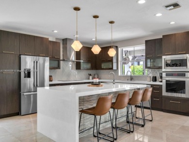 INCREDIBLE BACKYARD, FULLY RENOVATED HOME W/ STUNNING VIEWS on Weston Hills Country Club in Florida - for sale on GolfHomes.com, golf home, golf lot