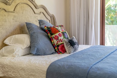 The villa consists of a main house and guesthouse, and is built on Bahia Principe Riviera Maya Golf Course in  - for sale on GolfHomes.com, golf home, golf lot