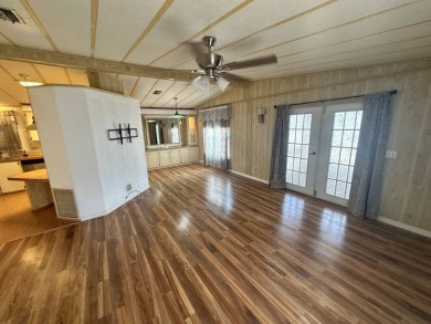 Lot Rent $1037.00    This well cared for 2-bedroom, 2-bathroom on Del Tura Golf and Country Club in Florida - for sale on GolfHomes.com, golf home, golf lot