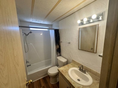 Lot Rent $1037.00    This well cared for 2-bedroom, 2-bathroom on Del Tura Golf and Country Club in Florida - for sale on GolfHomes.com, golf home, golf lot