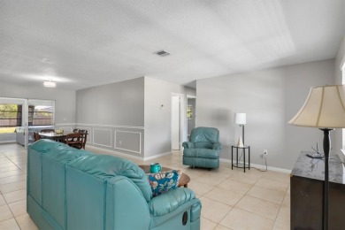 SPACIOUS AND UPDATED.  This 2 bedroom, 2 bath, 1 car garage home on Port Charlotte Golf Club in Florida - for sale on GolfHomes.com, golf home, golf lot