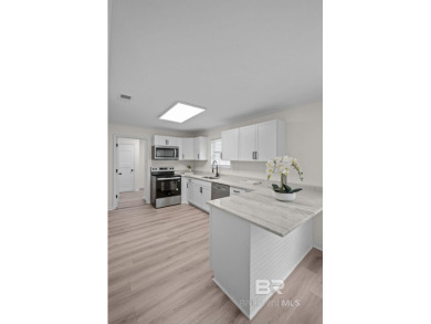 Completely renovated and move-in ready, this stunning Lake on Lake Forest Yacht and Country Club in Alabama - for sale on GolfHomes.com, golf home, golf lot