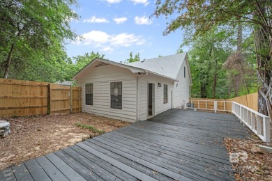 Completely renovated and move-in ready, this stunning Lake on Lake Forest Yacht and Country Club in Alabama - for sale on GolfHomes.com, golf home, golf lot