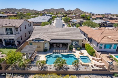This home is a luxurious desert retreat with mountain views in on Estrella Mountain Ranch Golf Course in Arizona - for sale on GolfHomes.com, golf home, golf lot