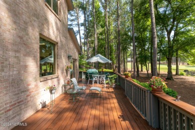 This wonderful brick, golf and waterfront home is situated on on Pinewild Country Club of Pinehurst in North Carolina - for sale on GolfHomes.com, golf home, golf lot