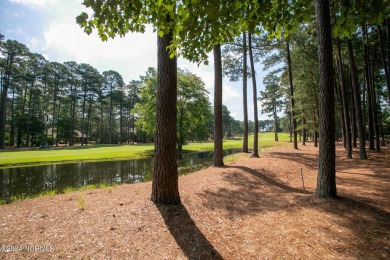 This wonderful brick, golf and waterfront home is situated on on Pinewild Country Club of Pinehurst in North Carolina - for sale on GolfHomes.com, golf home, golf lot