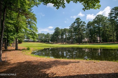 This wonderful brick, golf and waterfront home is situated on on Pinewild Country Club of Pinehurst in North Carolina - for sale on GolfHomes.com, golf home, golf lot