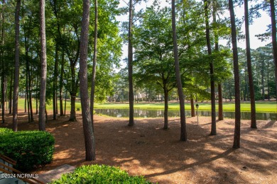 This wonderful brick, golf and waterfront home is situated on on Pinewild Country Club of Pinehurst in North Carolina - for sale on GolfHomes.com, golf home, golf lot