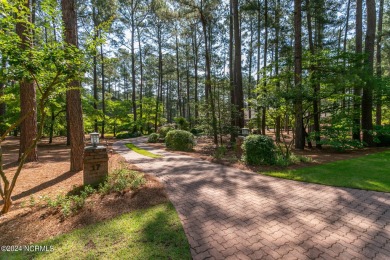 This wonderful brick, golf and waterfront home is situated on on Pinewild Country Club of Pinehurst in North Carolina - for sale on GolfHomes.com, golf home, golf lot