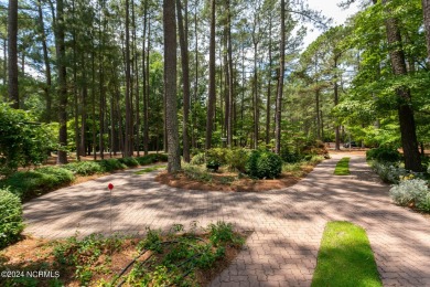 This wonderful brick, golf and waterfront home is situated on on Pinewild Country Club of Pinehurst in North Carolina - for sale on GolfHomes.com, golf home, golf lot