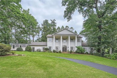 Nestled on a spacious meticulously landscaped site in East Cobbs on Atlanta Country Club in Georgia - for sale on GolfHomes.com, golf home, golf lot